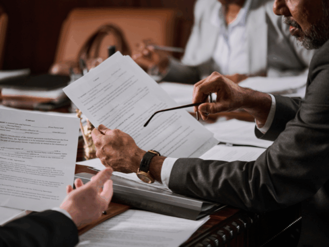 Entrepreneur engaged in discussion during business closure