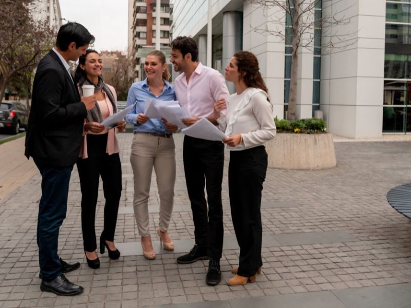 Outsourced HR services team engaged in a discussion