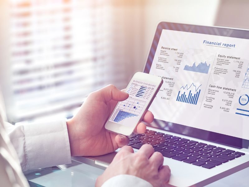 Outsourced accountant working on consolidated financial report of a startup