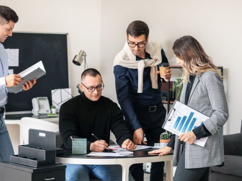 Startup team discussing financial management measures.