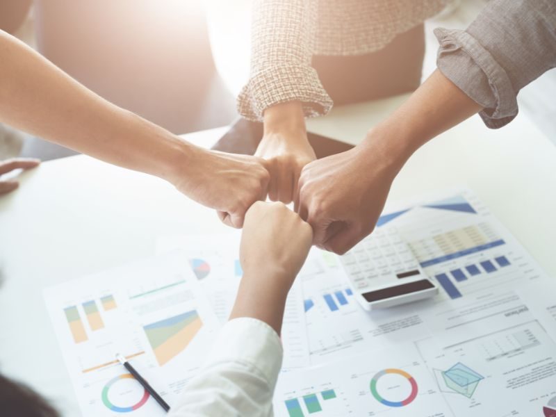 Team celebrating fundraising success