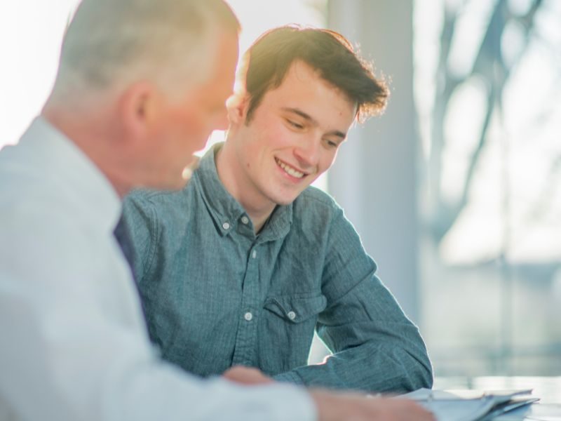 Senior businessman interaction with intern